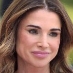Queen Rania is sublime in two-piece glance and darkish glasses on sombre instance
