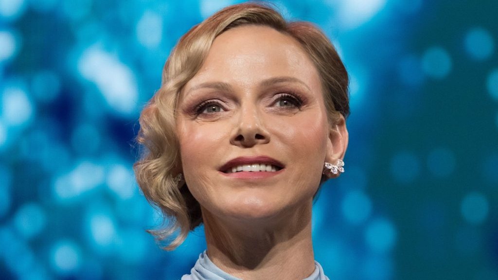 Princess Charlene has a Cinderella second in Louis Vuitton robe