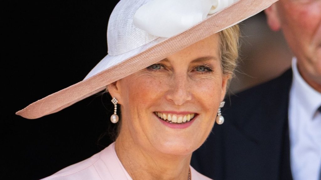 Duchess Sophie is resplendent in sizzling red swishy pleated skirt