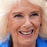 Queen Camilla cuddles cute rescue canine Moley at ultra-private house