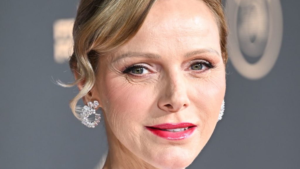 Princess Charlene is a pink carpet bombshell in slinky backless robe