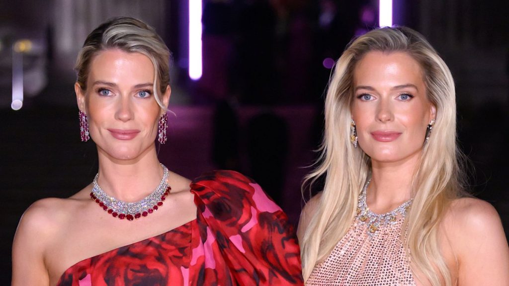 Girl Amelia and Girl Eliza Spencer channel Barbie in ‘bold’ sweet red ball robes