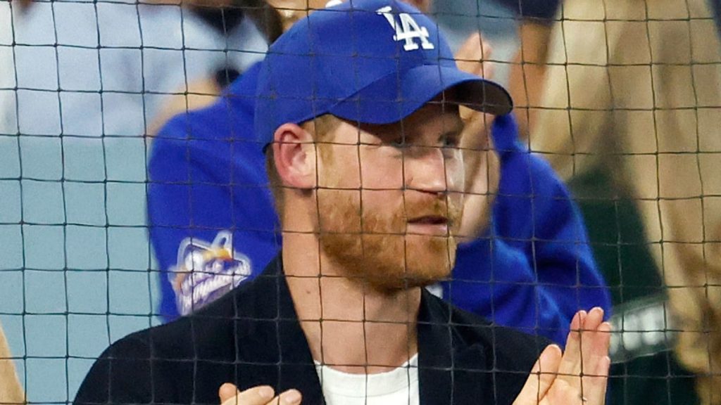 Prince Harry apologizes for dressed in LA Dodgers hat, says ‘I used to be underneath duress’