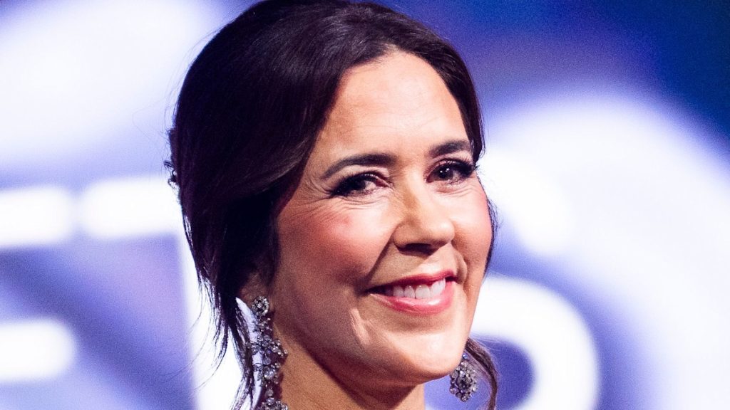 Queen Mary is a way spectacle in cut-out pencil skirt – and glitter heels